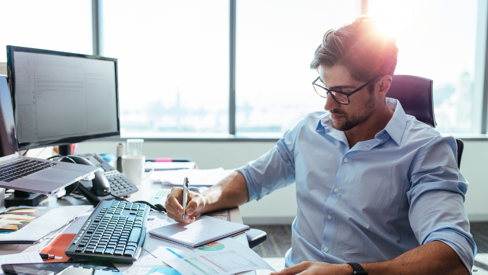 man-overwhelmed-by-busywork